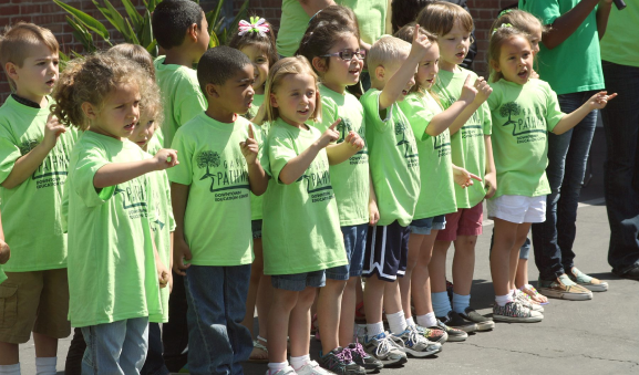 Children from Garden Pathways wearing green shirts